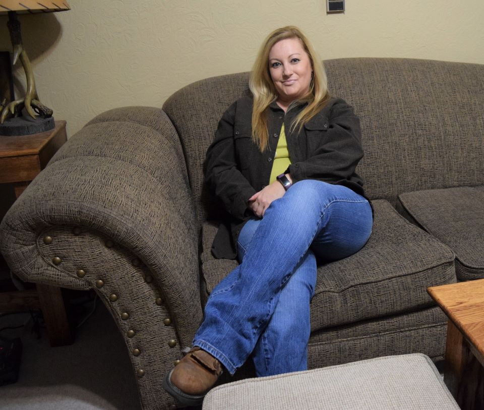 the writer of Sweenolia sitting on her couch